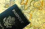 A United States passport resting on a map of West Africa
